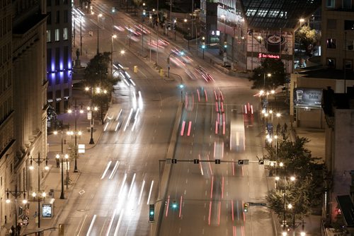 Nighttime traffic along Main Street at Portage Avenue. For City Beautiful book 140915 - Monday, September 15, 2014 - (Melissa Tait / Winnipeg Free Press)