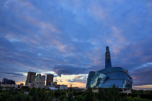Clouds over the downtown skyline and the Canadian Museum for Human Rights. For City Beautiful book 140914 - Sunday, September 14, 2014 - (Melissa Tait / Winnipeg Free Press)