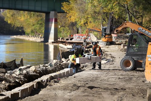 The River walk along the Assiniboine undergoes some reinforcements after a summer of high water caused damage to the shoreline and walkway. Pedestrians enjoy walking in the open portions on it Saturday in beautiful sunny weather.    Standup photo Oct 11,  2014 Ruth Bonneville / Winnipeg Free Press
