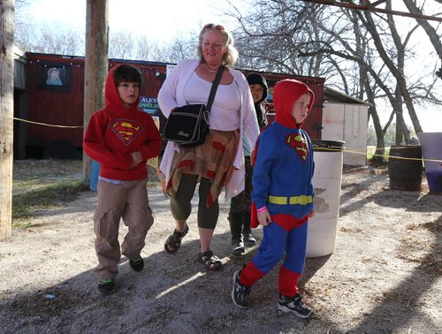 A spooked and costumed Julian Schellenberg-Sprung, 6, (right) leaves the ÄòAlice In ZombielandÄô maze with his mom Janine Schellenberg and his friend Noah Hyska-Pottuck, 6, at Six Pines Haunted Attractions part north of Winnipeg on Sat., Oct. 11, 2014. The interactive attractions will be open until Halloween. Photo by Jason Halstead/Winnipeg Free Press