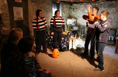 Tweedle Dee (Hope Figueroa, second left) and Tweedle Dum (Rachel Hiebert, left) get dancing lessons from David Froese, 10, (second right) and Kole Stroud, 11, during their show at Six Pines Haunted Attractions part north of Winnipeg on Sat., Oct. 11, 2014. The interactive attractions will be open until Halloween. Photo by Jason Halstead/Winnipeg Free Press