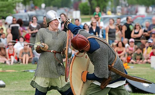 MIKE DEAL / WINNIPEG FREE PRESS 070804 "Vikings" demonstrate warfare tactics during the Icelandic Festival in Gimli on Saturday afternoon.
