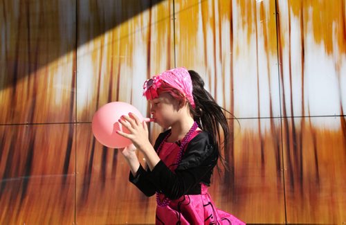 Eight-year-old Isabella Burgos - transgender plays with her pink balloon  Centennial Square Saturday after a rally was held in support of her wanting to live her life as a girl even though she is biologically a boy. Her parents - Izzy (mom) and Dale (dad), support her decision fully.   See Alex Paul story. Oct 11,  2014 Ruth Bonneville / Winnipeg Free Press