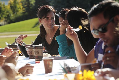 October 13, 2014 - 141013  -  Lorelle Perry, Director of Kidbridge, talks to newcomers during a KidBridge Thanksgiving feast. KidBridge launched their "First Nations, All Nations: Setting the Table" project with a intercultural Thanksgiving potluck feast at The Forks  Monday, October 13, 2014. John Woods / Winnipeg Free Press