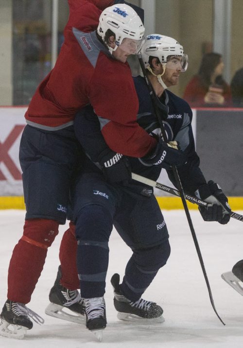 Winnipeg Jets practice at the MTS IcePlex Tuesday morning. Winnipeg Jets' Jacob Trouba (8) and Jim Slater (19) during practice. 141014 - Tuesday, October 14, 2014 -  (MIKE DEAL / WINNIPEG FREE PRESS)