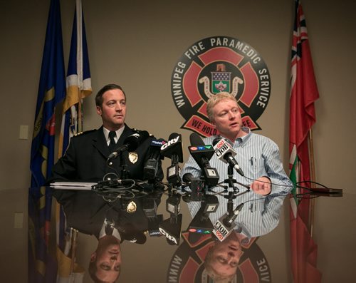 WFPS Acting Assistant Chief Tom Wallace (left) and Dr. Rob Grierson, Medical Director, speak to media Tuesday afternoon in response to local firefighter's union concerns about Ebola preparation.  141014 - Tuesday, October 14, 2014 - (Melissa Tait / Winnipeg Free Press)