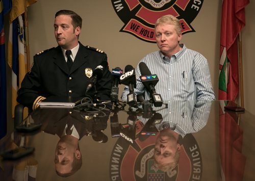 WFPS Acting Assistant Chief Tom Wallace (left) and Dr. Rob Grierson, Medical Director, speak to media Tuesday afternoon in response to local firefighter's union concerns about Ebola preparation.  141014 - Tuesday, October 14, 2014 - (Melissa Tait / Winnipeg Free Press)