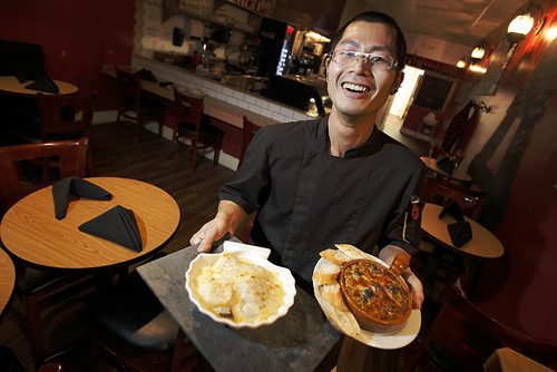 October 14, 2014 - 141014  -  Cam Tran owner and chef at Café Ce Soir with Coquilles Saint-Jacques and Escargots in Garlic Butter Tuesday, October 14, 2014.   John Woods / Winnipeg Free Press