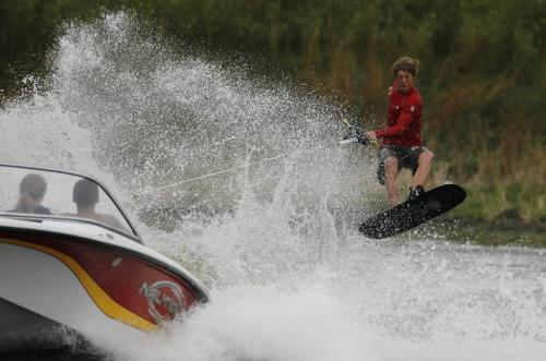 John Woods / Winnipeg Free Press / August 6/07- 070806   Sean Vielhaber (15) catches some air during a training session at the waterski training centre on Murdoch Road Sunday August 6/07.   Vielhaber is a member of the Manitoba team and was training for next weekends national waterski championships in Calgary.  Team mates Cole and Taryn Grant look on from the boat.