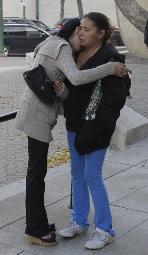 After the court case for the  sentencing of Nicholas Abraham, 25, and Jonathon Starr, 32,  at right Lana Fontaine, the sister of Eugene Fontaine outside the Law Court . Mike McIntyre story.  Wayne Glowacki/Winnipeg Free Press Oct. 15 2014