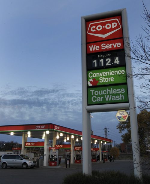 Motorists fill up Thursday morning with lower gas prices. Co-op gas bar on Osborne St. was selling regular fuel at 112.4. Wayne Glowacki/Winnipeg Free Press Oct. 16 2014