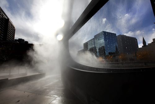An interesting combination of fog, light, water and reflection combined together in this photo of a Waterfall feature in the park next to the Millennium Library entitled - emptyful. (Bill Pechet, stainless steel, water, lights, fog, weather)  Thursday afternoon,   Standup photo.   Oct 16,  2014 Ruth Bonneville / Winnipeg Free Press
