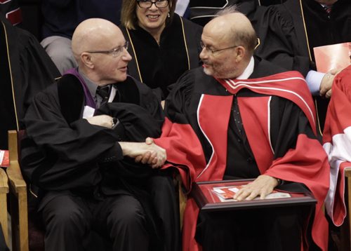 At left, Allen Mills congratulates Dr. Christopher Leo named Professor Emeritus  at the  the 2014 Autumn Convocation Ceremony at the U of W  Duckworth Centre Friday.  see release Wayne Glowacki / Winnipeg Free Press Oct.17 2014