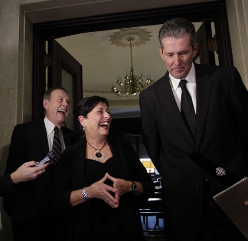 Bonnie Mitchelson with her husband Don at left and  Opposition Leader Brian Pallister talk to reporters after Bonnie Mitchelson announced Friday she won't be seeking re-election. Bruce Owen story Wayne Glowacki / Winnipeg Free Press Oct.17 2014