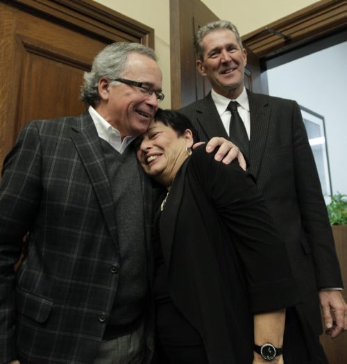 Bonnie Mitchelson is hugged by former Premier Gary Filmon beside Opposition Leader Brian Pallister after she arrive at a surprise reception Friday with former PC MLAs at the Manitoba Legislative Bld. She announced Friday she won't be seeking re-election. Bruce Owen story Wayne Glowacki / Winnipeg Free Press Oct.17 2014