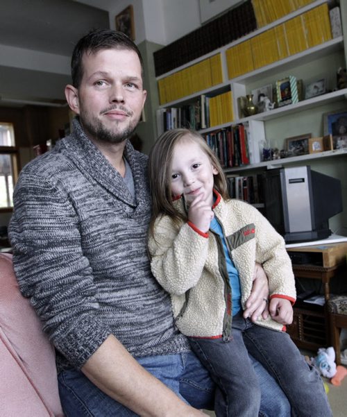 US army deserter Joshua Key with his son Rosco.  Joshua wants to live in peace in Canada and is asking the province to provide him with health care here like a privately sponsored refugee would receive. His wife is trying to sponsor him but with no status in Canada, he could be sent back to the U.S. any day now, court martialed for desertion and imprisoned. Carol Sanders story. Wayne Glowacki / Winnipeg Free Press Oct. 17 2014