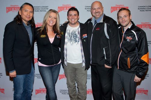 Dauphin Countryfest recently announced the first round of artists for its 2015 summer music event at a news conference at McPhillips Station Casino. Pictured, from left, are radio personalities David McLeod (NCI FM), Samantha Stevens (QX 104), Brody Jackson (QX 104), Ryan Simpson (CFRY) and Travis Roberts (Country 93). John Johnston / Winnipeg Free Press)