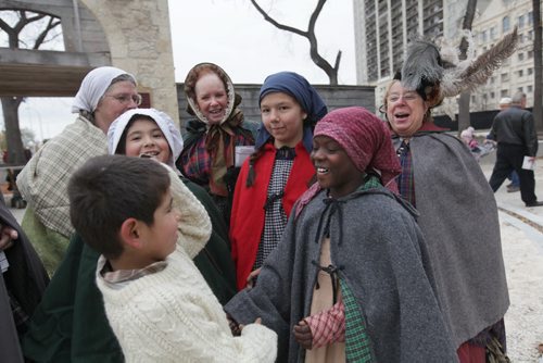Students and members of the Manitoba Historical Society are all smiles while dressed 1860's period costume as they greet guest to the unveiling of the Upper Fort Garry Provincial Park  Saturday. Oct 17,  2014 Ruth Bonneville / Winnipeg Free Press