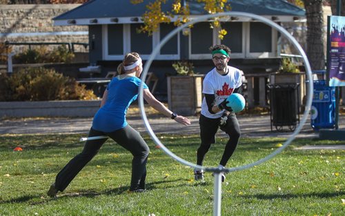 Members of the Winnipeg Whomping Willows Quidditch team Renata Hrymdzio (left) and Jason Rosenberg (right) take part in an open practice at The Forks in an effort to drum up interest in the game. 141019 - Sunday, October 19, 2014 -  (MIKE DEAL / WINNIPEG FREE PRESS)