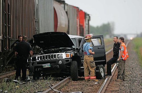 BORIS MINKEVICH / WINNIPEG FREE PRESS  070808 Hummer vs. Train Harstone Rd. and Wilks Ave. on the CNR rail line. At least 1 taken to hospital.