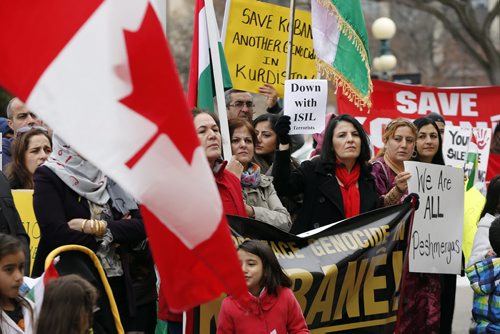 LOCAL . About 150 Kurds  demonstrated outside the  Manitoba  Legislature at noon Monday ,against the ISIL  genocide of Kurds in Kobani Syria  . Carol Sanders story .  Oct. 20 2014 / KEN GIGLIOTTI / WINNIPEG FREE PRESS