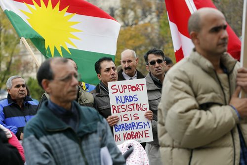 LOCAL . About 150 Kurds  demonstrated outside the  Manitoba  Legislature at noon Monday ,against the ISIL  (ISIS) genocide of Kurds in Kobani Syria  . Carol Sanders story .  Oct. 20 2014 / KEN GIGLIOTTI / WINNIPEG FREE PRESS