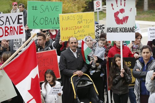 LOCAL . About 150 Kurds  demonstrated outside the  Manitoba  Legislature at noon Monday ,against the ISIL ( ISIS)  genocide of Kurds in Kobani Syria  . Carol Sanders story .  Oct. 20 2014 / KEN GIGLIOTTI / WINNIPEG FREE PRESS