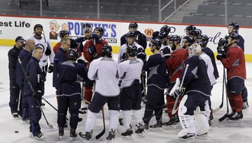 Winnipeg Jets head coach Paul Maurice speaks to players after the pre-game skate Tuesday morning in the MTS Centre. The Jets play the Hurricanes at 7P.M. Tuesday night.   Wayne Glowacki / Winnipeg Free Press Oct. 21 2014