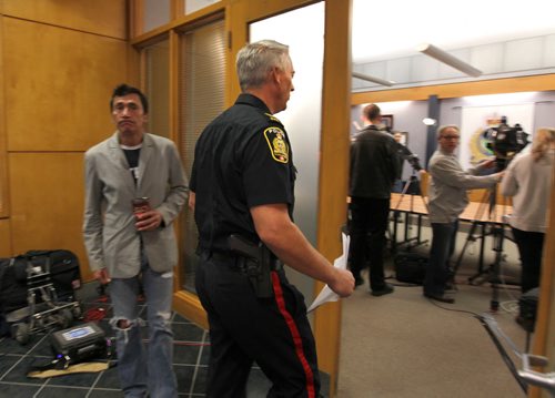 Constable Eric Hofley makes his way into press conference to make grim announcement to the media at PSB about the remains of 4 infant babies being found in a storage locker at in Winnipeg Tuesday morning.   Oct 21,  2014 Ruth Bonneville / Winnipeg Free Press