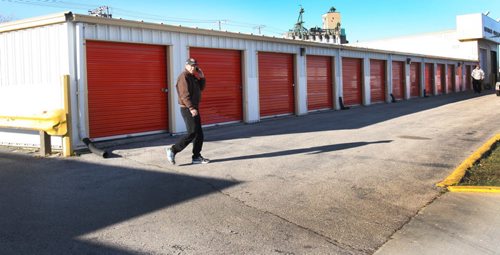 Workers were outside the U-Haul storage lockers at Elgin Ave and McPhillips on Tuesday- Winnipeg Police said they were called to a storage locker, after a worker discovered human remains of 3-4 babies on Monday afternoon- See Randy Turner story - Oct 21, 2014   (JOE BRYKSA / WINNIPEG FREE PRESS)