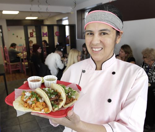 Restaurant Review. BMC Market at 722 Osborne St. The Owner, Beatriz Marivel Calderon-Villasenor with three tacos,  a Pastor,  Barbacoa and a Chorizo.    Marion Warhaft story  Wayne Glowacki / Winnipeg Free Press Oct. 21 2014