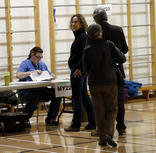 Election Day Winnipeg Mayoral Candidates  about a dozen people lined up before 8am at Luxton School polling station to vote . Oct. 22 2014 / KEN GIGLIOTTI / WINNIPEG FREE PRESS