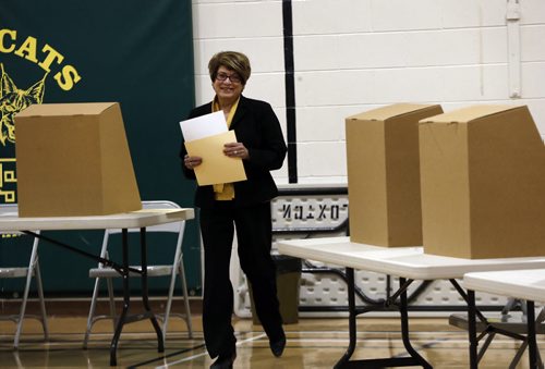 Election Day Winnipeg Mayoral Candidate Judy Wasylycia-Leis casts her vote just after 9am at Luxton School polling station   .  About a dozen people lined up before 8am at Luxton School polling station to vote . Oct. 22 2014 / KEN GIGLIOTTI / WINNIPEG FREE PRESS