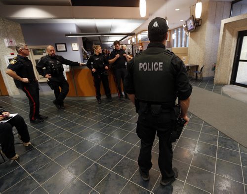 WPS have police guards in the public entrance and waiting area of PSB. Wpg Police spokesperson Constable Eric Hofley would not confirm the reason why they are  there .  Oct. 22 2014 / KEN GIGLIOTTI / WINNIPEG FREE PRESS
