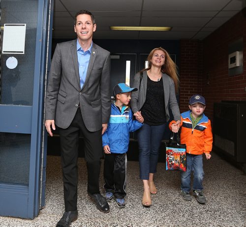 Winnipeg mayoral candidate Brian Bowman arrives to vote at Charleswood School with his family Äì¬wife, Tracy, and sons Hayden, 6, (second left) and Austin, 4 Äì on Wed., Oct. 22, 2014. Photo by Jason Halstead/Winnipeg Free Press