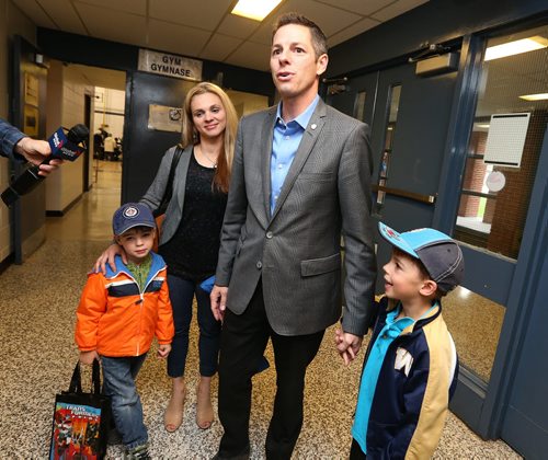 Winnipeg mayoral candidate Brian Bowman speaks to media after voting at Charleswood School with his family Äì¬wife, Tracy, and sons Hayden, 6, (right) and Austin, 4 Äì on Wed., Oct. 22, 2014. Photo by Jason Halstead/Winnipeg Free Press