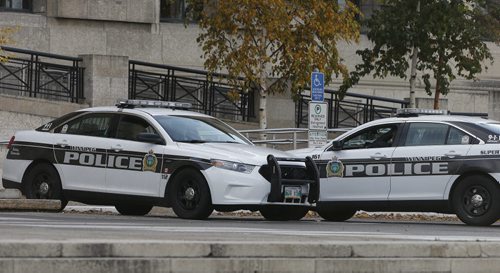 WPS have been on guard outside the Manitoba Legislature as added security after Ottwa shooting . WPS also have police guards in the public entrance and waiting area of PSB.  .  Oct. 22 2014 / KEN GIGLIOTTI / WINNIPEG FREE PRESS