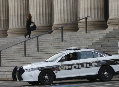 WPS have been on guard outside the Manitoba Legislature as added security after Ottwa shooting . WPS also have police guards in the public entrance and waiting area of PSB.  .  Oct. 22 2014 / KEN GIGLIOTTI / WINNIPEG FREE PRESS