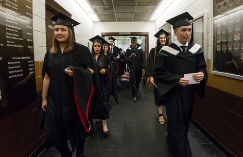 Graduating students make their way from the Max Bell Track Centre to the Investors Group gym for the fall 2014 University of Manitoba Convocation. 141022 - Wednesday, October 22, 2014 -  (MIKE DEAL / WINNIPEG FREE PRESS)