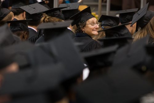 Rebecca Muyal smiles at the watching crowd as graduating students gather in the Investors Group gym for the fall 2014 University of Manitoba Convocation. 141022 - Wednesday, October 22, 2014 -  (MIKE DEAL / WINNIPEG FREE PRESS)