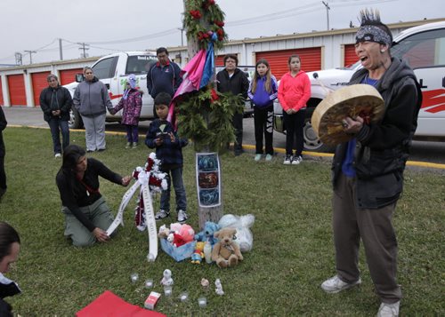 At right, Vin Clarke along with about 60 people attended the prayer and vigil held at the U-Haul storage facility on McPhillips Street Wednesday where human remains were found in a locker earlier this week.  Vin and his wife Jennifer Spence organized the vigil. Carol Sanders story. Wayne Glowacki/Winnipeg Free Press Oct.22  2014