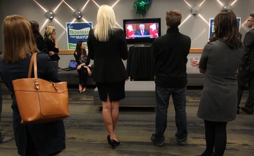 Media and Brian Bowman supporters wathe Prime Minister Harpers address on todays shootings in Ottawa at the Bowman campaign headquarters at the Inn at the Forks in Winnipeg Wednesday night-See Aldo Santin story - Oct 22, 2014   (JOE BRYKSA / WINNIPEG FREE PRESS)