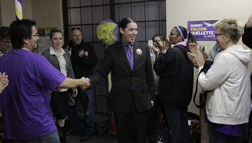 Mayoral candidate Robert-Falcon Ouellette is greeted by his supporters as he arrives at his HQ on election night. RRC student Jen Walichnowski/ story Wayne Glowacki/Winnipeg Free Press Oct.22  2014