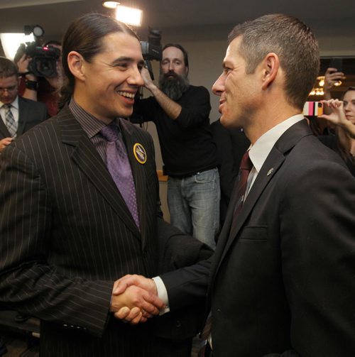 Mayoral candidate Robert-Falcon Ouellette , left, congratulates mayor elect Brian Bowman at his campaign HQ at the Inn at the Forks late Wednesday evening- See Aldo Santin Story - Oct 22, 2014   (JOE BRYKSA / WINNIPEG FREE PRESS)