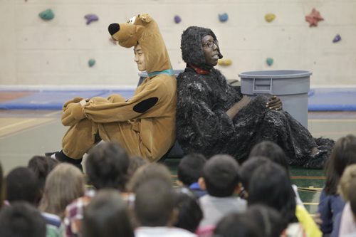 The Winnipeg Humane Society in partnership with the Pembina Trails School Division created the Trampers Story, it was performed for children at the Ryerson Elementary School Thursday. The 30-minute one-act play teaches the Humane Educational animal welfare curriculum to grades one to four in a creative and interactive way. At right is actor Buhle Mwanza as Tramper and Galvin Niu as Kriss Kross.  Doug Speirs  story Wayne Glowacki/Winnipeg Free Press Oct.23  2014