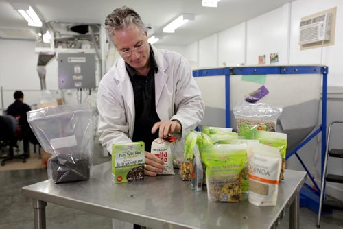 Murray Ratuski, owner of Shoal Lake Wild Rice Ltd, production plant located in Transcona.  Ratuski is shown with some of his products such as, minute wild rice, in his warehouse and with a bin full of wild rice.    See Bill Redekop's story.   Oct 23,  2014 Ruth Bonneville / Winnipeg Free Press