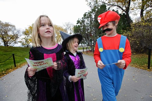 Dressed up as a witch, five year old Taylor McKenzie (middle) laughs with Jonah Vanderhorst dressed as Mario (6yrs,) as they make their way on a scavenger hunt at the Zoo's Halloween Spooktacular event Friday with their families while Taylor's sister Katie  (vampire) looks on.  The Assiniboine Park Zoos Halloween Weekend Spooktacular runs all weekend with 25% of regular admission when wearing a costume.    Oct 24,  2014 Ruth Bonneville / Winnipeg Free Press