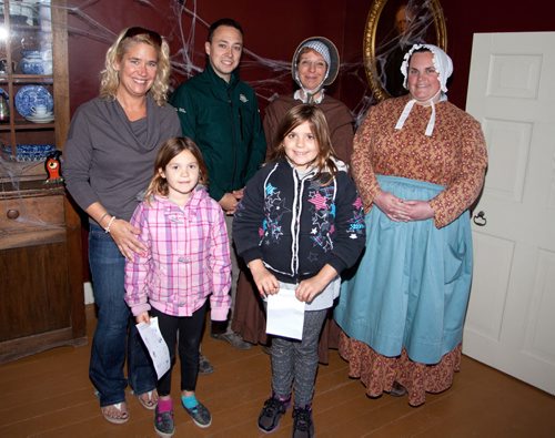 Lower Fort Garry recently offered a private tour of its Lower Fort Scary event for families and children involved with Variety, the Childrens Charity. Front row (from left): Josie Bisso, Cazie Bisson and Maya Bisson. Back row (from left): David Lavalee, Barb Ford and Amanda Shewtchenko of Parks Canada. (John Johnston / Winnipeg Free Press)