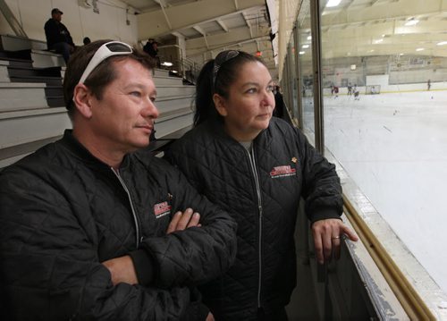 In the name of prevention, fans of minor hockey in Winnipeg can expect to see a Winnipeg Police officer in local rinks this winter.- Parents- Richard and Holly Schwenzer- of a player- on the Norquay Knights-11 A1 practicing at the West Kildonan Arena- 346 Perth Ave comment -See  Ashley Prest story - Oct 24, 2014   (JOE BRYKSA / WINNIPEG FREE PRESS)