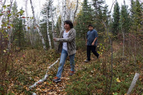 Rainne Robinson (left), 12, and Adrien Flamand (left), 11, walk along a path at the school camp in Grand Rapids, MB. 140930 - Friday, September 24, 2014 -  (MIKE DEAL / WINNIPEG FREE PRESS)